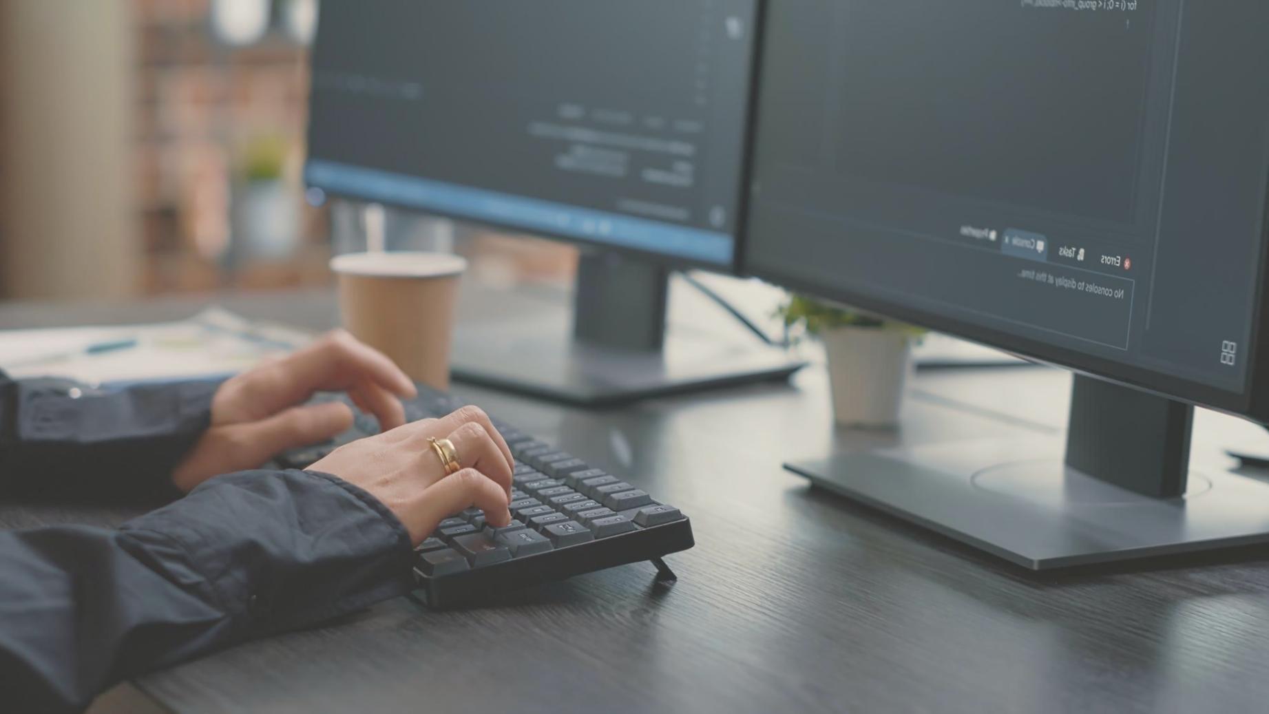 Students collaborating on JavaScript projects in modern learning environment